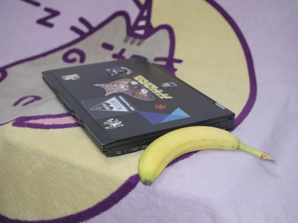 laptop next to banana