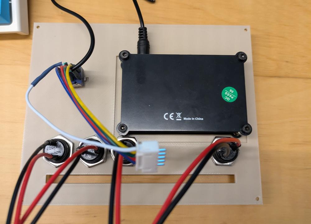 The back side of the above image. It has wires coming off of it.