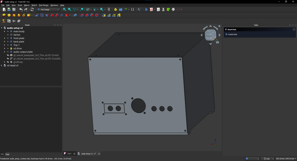 A screenshot of a 3d model in FreeCAD. The back of the model is shown, with various holes for components to be attached