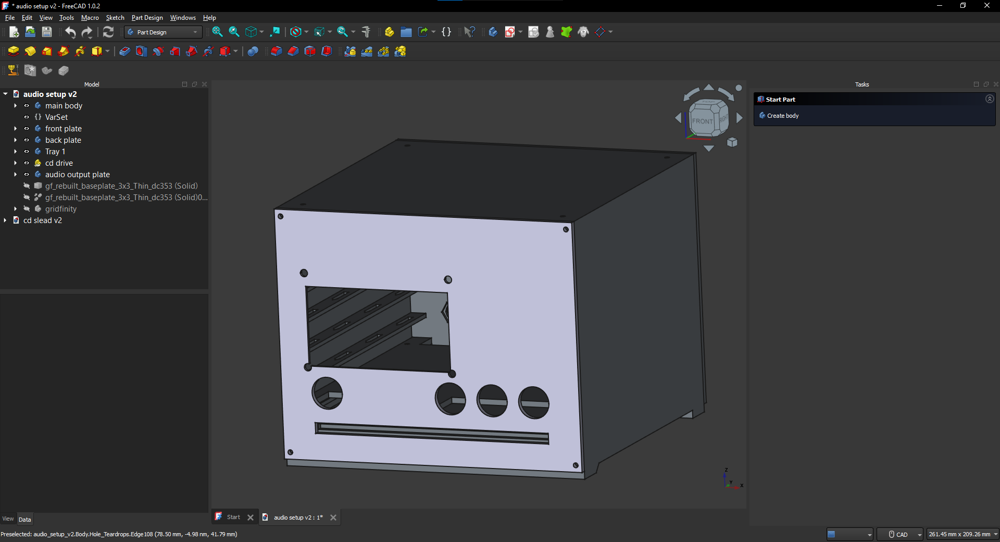 A screenshot of a 3d model in FreeCAD. The model is boxy with various holes in the front for components to be attached