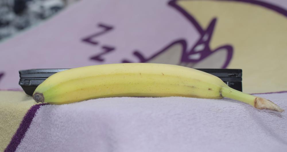 laptop behind banana