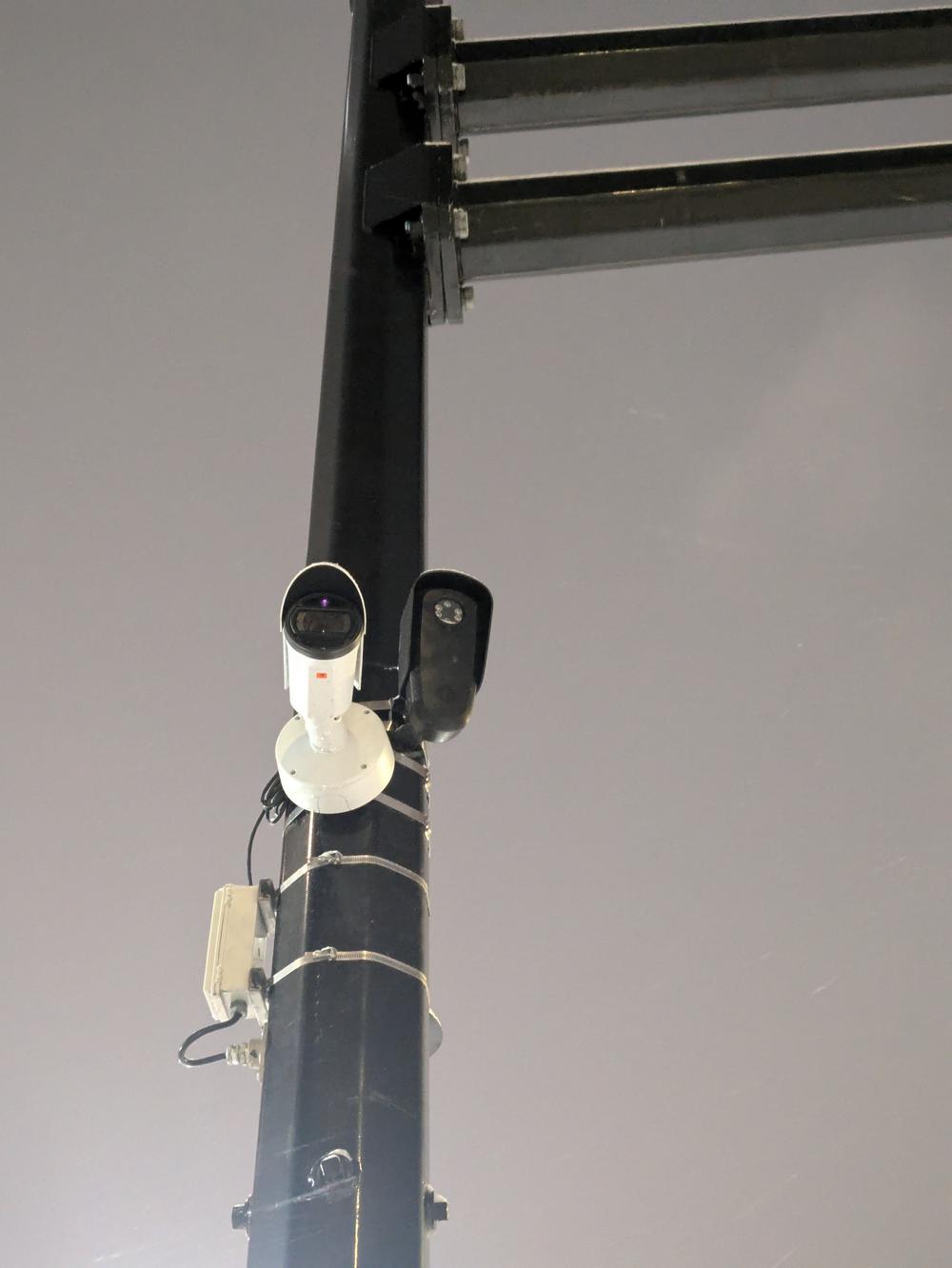 Flock camera on pole next to another camera