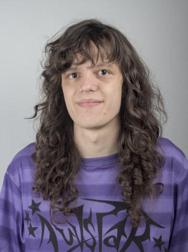 A picture of me. I have long brown curly hair and light skin